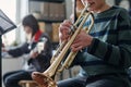 Unrecognizable Boy Playing Trumpet Royalty Free Stock Photo