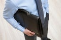 Unrecognizable businessman holding a black briefcase Royalty Free Stock Photo