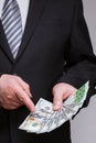 Unrecognizable businessman holding dollars and euro Royalty Free Stock Photo