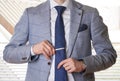 Unrecognizable businessman setting the tie straight