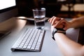 Unrecognizable businesswoman in her office with smartwatch. Royalty Free Stock Photo