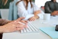 Unrecognizable businesswoman on computer keyboard, typing, working at office. Royalty Free Stock Photo