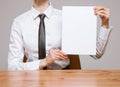 Unrecognizable businesswoman holding an empty leaf of paper