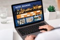 Unrecognizable businesswoman using hotel booking website, office interior