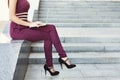 Unrecognizable businesswoman working with laptop outdoors