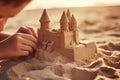 Unrecognizable children hands child kid son daughter baby building sand castle on summer coastline sandy beach Royalty Free Stock Photo