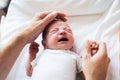 Unrecognizable father caressing crying newborn baby son Royalty Free Stock Photo