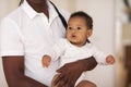 Unrecognizable Father Holding Little Cute Black Infant Boy In Hands Royalty Free Stock Photo