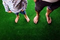 Unrecognizable father and son standing, against artificial green Royalty Free Stock Photo