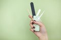 Crop woman with manicure supplies