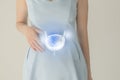 Woman in blue clothes holding virtual bladder in hand. Handrawn human organ, detox and healthcare, healthcare hospital service