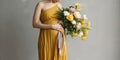 Unrecognizable female in yellow dress stroking baby belly while standing with gentle floral bouquet against gray wall. Generative