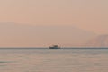 Unrecognizable fisherman fishing from the boat at Adriatic sea in summer morning Royalty Free Stock Photo