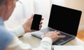 Unrecognizable Gentleman Using Smartphone And Laptop Sitting In Office, Mockup Royalty Free Stock Photo