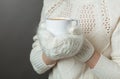 Unrecognizable girl feeling cold and holding a cup of hot coffee Royalty Free Stock Photo