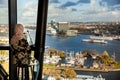 Unrecognizable girl in hijab looking on Amsterdam from aerial view, Holland