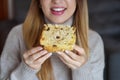 Unrecognizable girl holding a slice of Panettone traditional Christmas cake