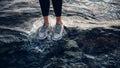 Unrecognizable girl in sneakers stands on water, view of legs, close-up. Religion climate business sport freedom concept