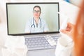 Unrecognizable girl is watching a video with medical prescriptions on a laptop. A woman conducts an online conversation