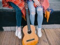 Unrecognizable girls have rest with guitar Royalty Free Stock Photo