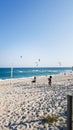 unrecognizable girls playing in a slackline at the beach