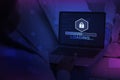Unrecognizable hacker using laptop with progress loading bar