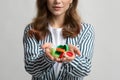 Unrecognizable Lady Holding Colorful Plastic Lids Bottle Cups In Hands Royalty Free Stock Photo