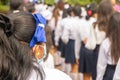Unrecognizable Latin American student girls wearing uniforms seen from behind