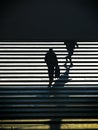 Unrecognizable lonely person silhouette walking upstairs