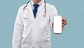 Unrecognizable Male Doctor Showing Mobile Phone Screen Over Blue Background