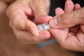 Man hands attaching net cable to RJ45 connector. Royalty Free Stock Photo