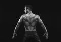 Unrecognizable man shows strong back muscles closeup Royalty Free Stock Photo
