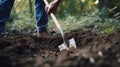Unrecognizable man digs a hole by shovel in garden Ai generated image Royalty Free Stock Photo