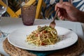 Unrecognizable man eating delicious traditional Italian pasta in Italian restaurant. Food concept Royalty Free Stock Photo