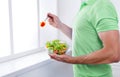 Unrecognizable man has healthy lunch, eating diet vegetable salad Royalty Free Stock Photo