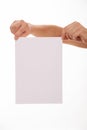 Unrecognizable man holding an empty sheet of paper Royalty Free Stock Photo