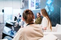 Unrecognizable man listening to speaker during business seminar