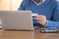 Unrecognizable man paying with credit card for online shopping Royalty Free Stock Photo