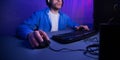 Unrecognizable Man Playing Computer Games Overnight Sitting Indoor, Cropped, Panorama