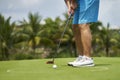 Unrecognizable man playing golf putting on green Royalty Free Stock Photo