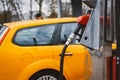 Unrecognizable man refueling car from gas station filling benzine gasoline fuel in car at gas station. Petrol high