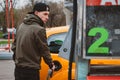 Unrecognizable man refueling car from gas station filling benzine gasoline fuel in car at gas station. Petrol high