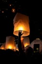 Unrecognizable man releasing paper lantern during Loi Krathong and Yi Peng festival in Chian Mai Royalty Free Stock Photo