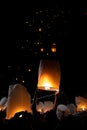 Unrecognizable man releasing paper lantern during Loi Krathong and Yi Peng festival in Chian Mai Royalty Free Stock Photo