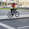 Unrecognizable man riding on the bike in the sity street. Healthy lifestyle, leisure activity