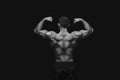 Unrecognizable man shows strong back muscles closeup Royalty Free Stock Photo