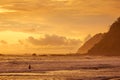 Unrecognizable man, in the water watching the sunset on a beach in Costa Rica Royalty Free Stock Photo