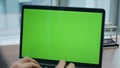 Unrecognizable manager working green screen laptop standing office table closeup Royalty Free Stock Photo