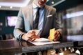 Mature businessman at hotel reception. Royalty Free Stock Photo