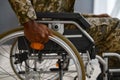 Unrecognizable military man with disability in wheelchair